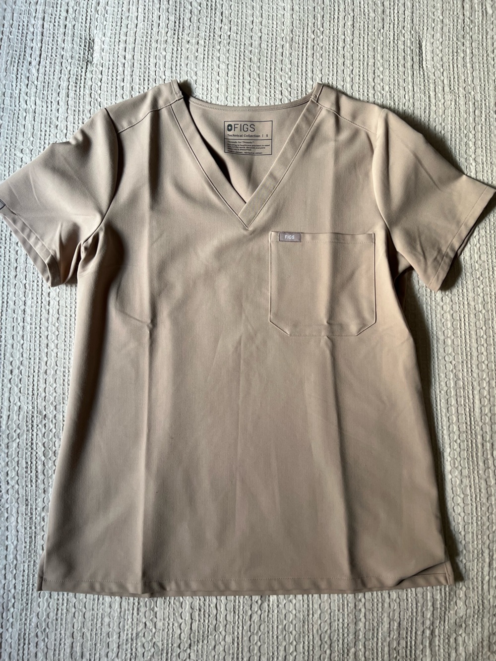 FIGS woman’s V-Neck Pocket Shirt in Beige